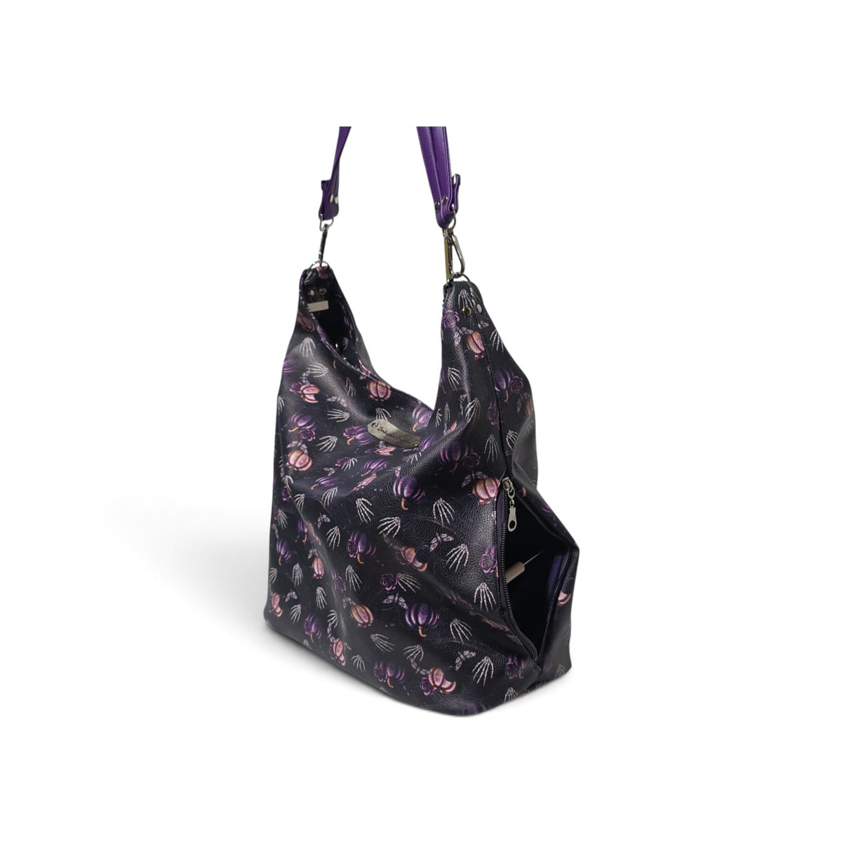 A black hobo shoulder bag with a purple and pink jellyfish pattern, featuring a matching purple shoulder strap and silver-tone hardware, shown on a white background.