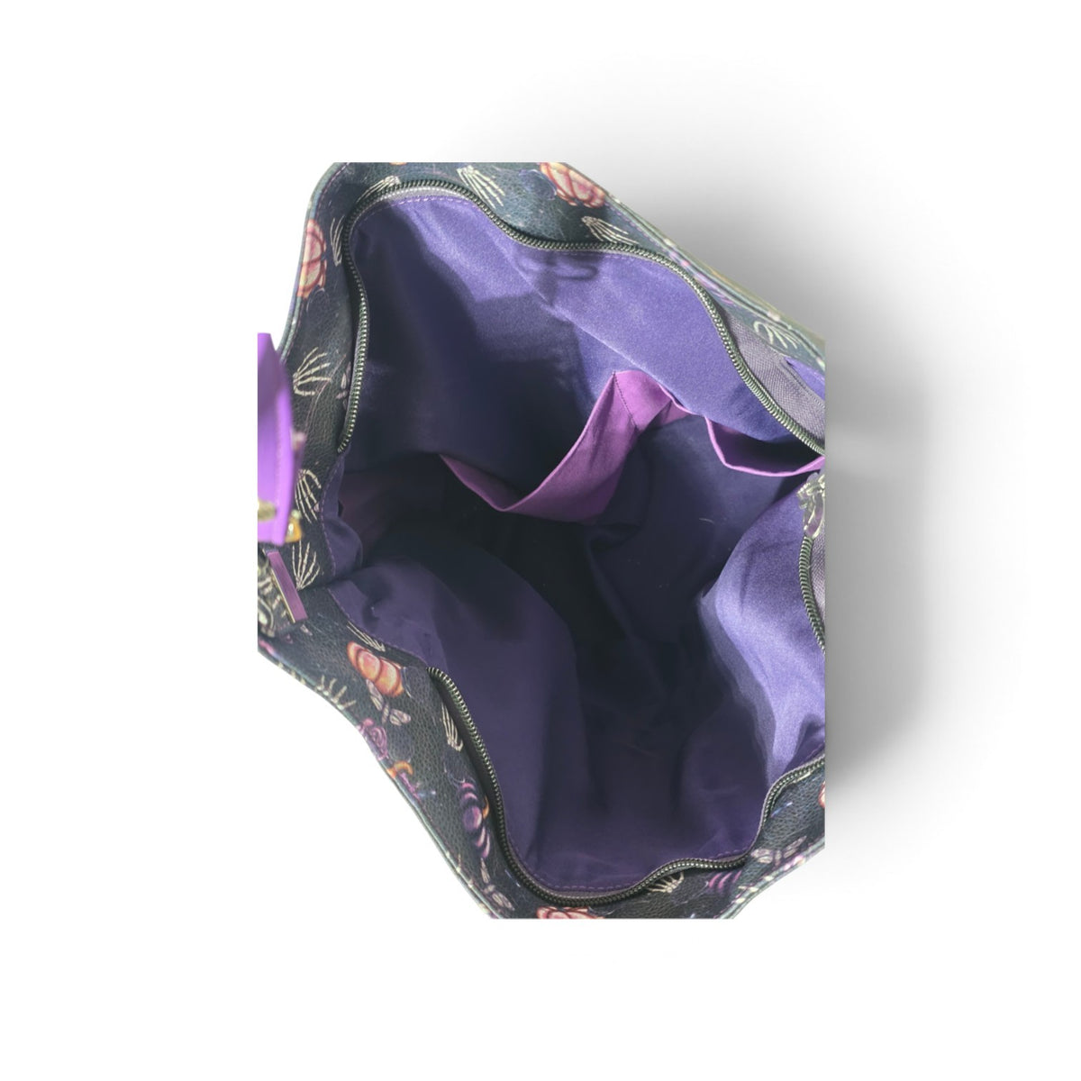An open hobo bag with a dark floral exterior and a vibrant purple satin-like interior lining, shown from a top-down perspective on a white background.