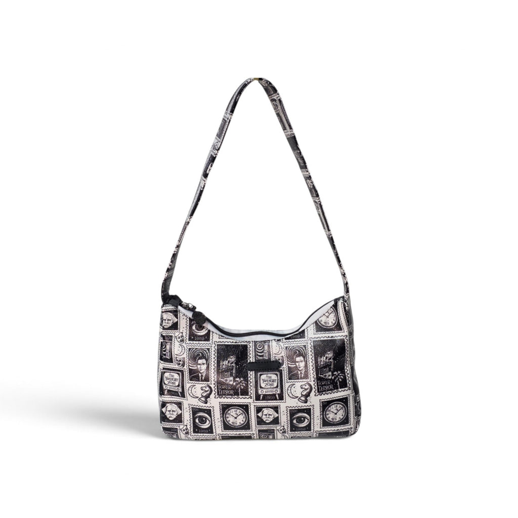 A black and white patterned hobo shoulder bag with a long strap, featuring a collage of vintage-style portrait frames and monochrome illustrations on a clean white background.