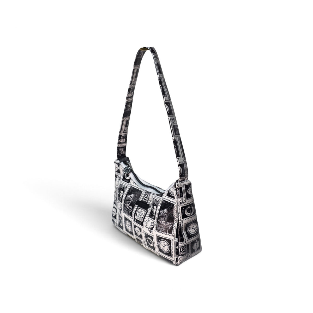 A black and white patterned shoulder bag with a single strap, featuring a geometric grid design with circular details, shown on a white background.