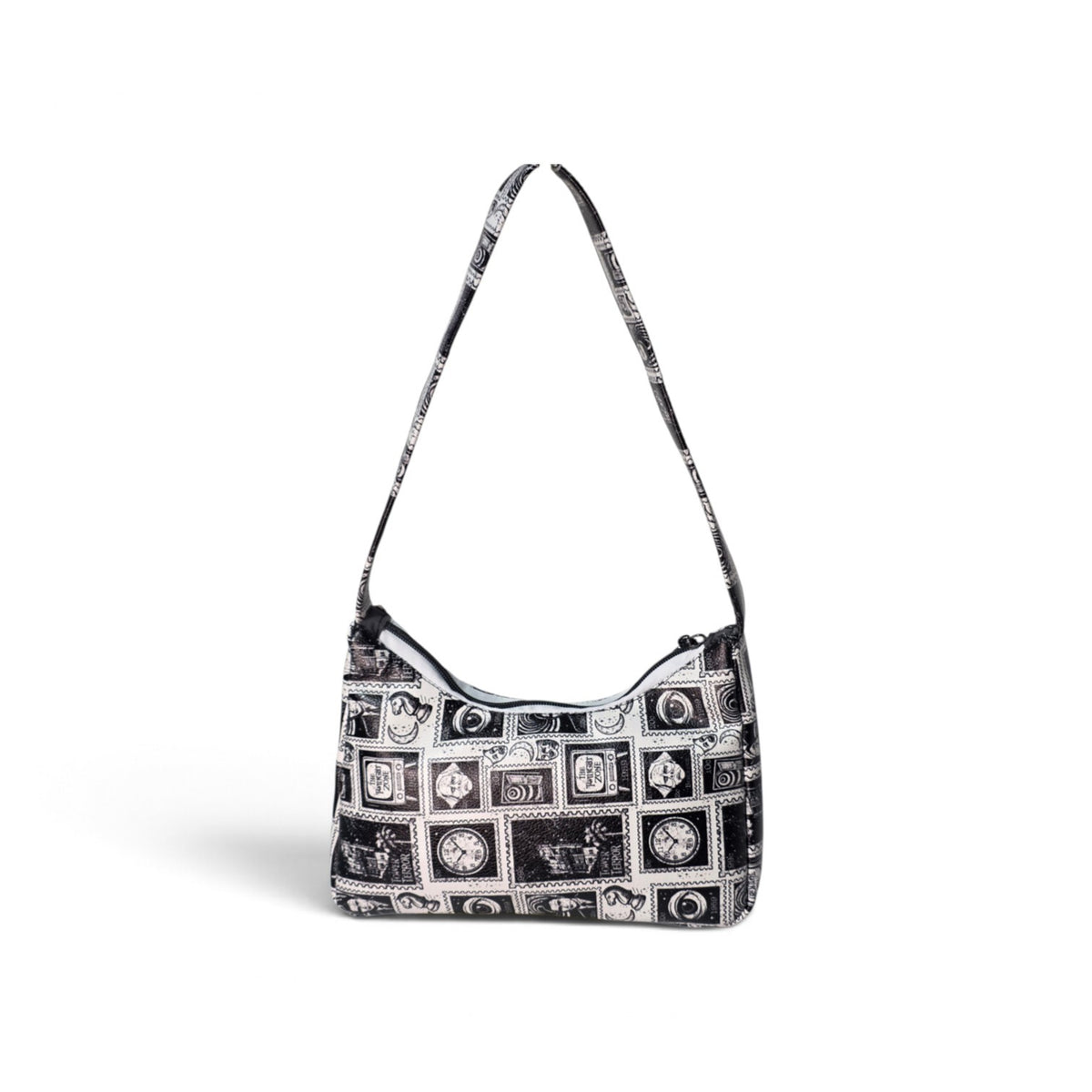A black and white patterned shoulder bag with a long strap, featuring a collage of vintage film reels and cassette tapes, shown on a white background.