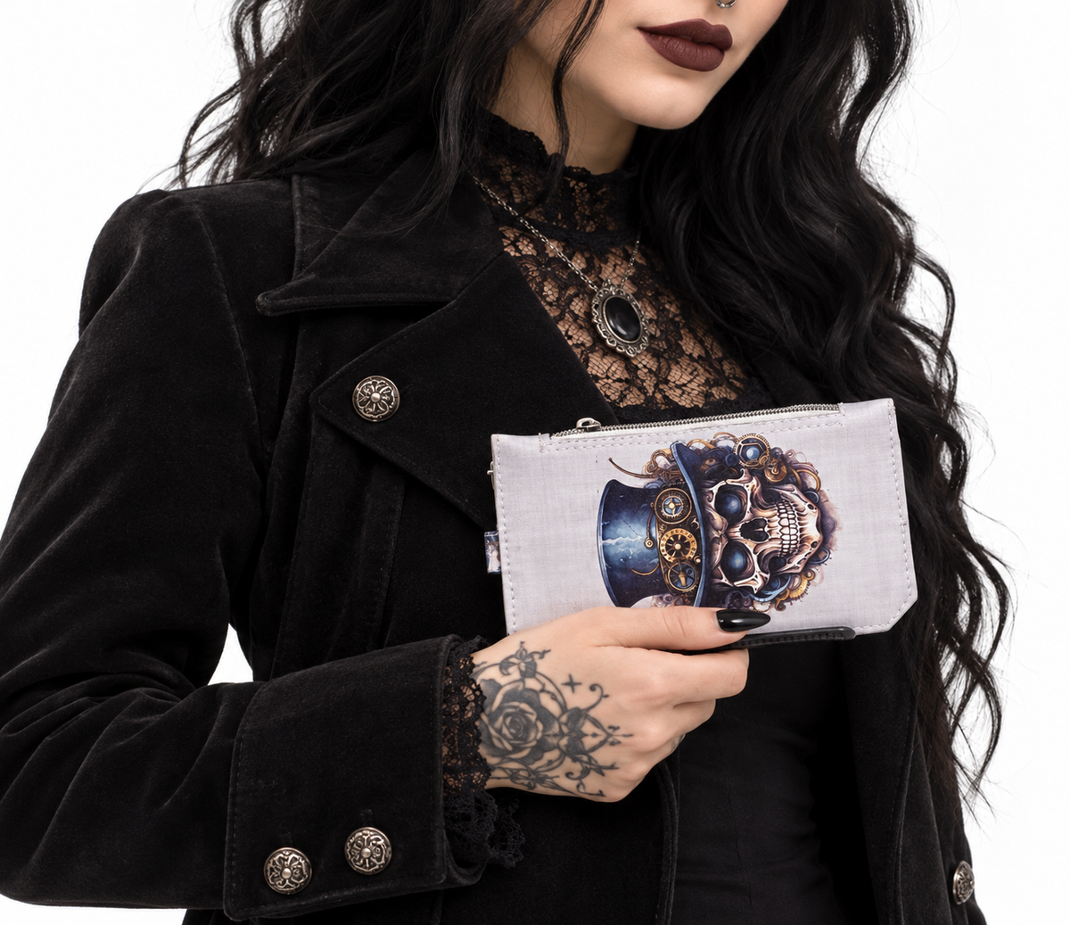 Model wearing black gothic clothing holding a handmade ivory steampunk skull wallet with a blue top hat and antique gold gears.