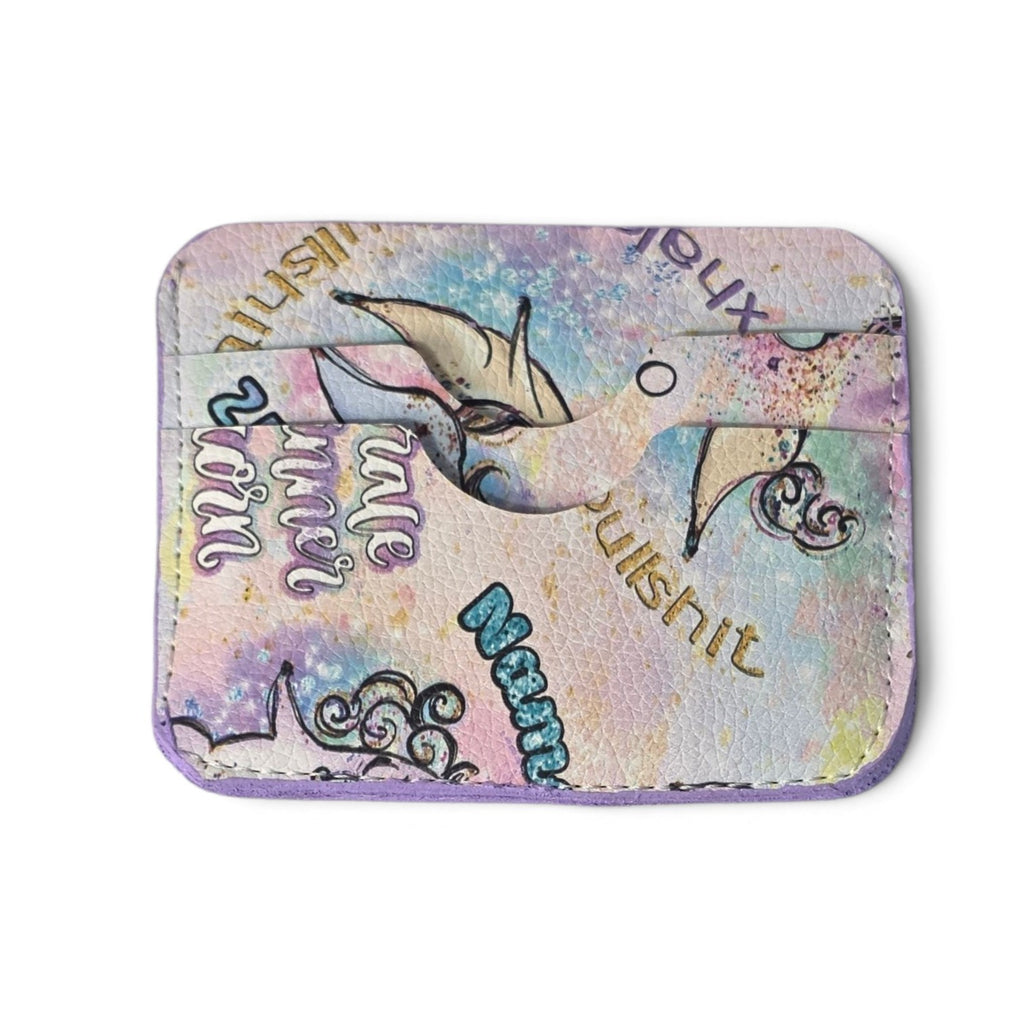 A small rectangular card holder or wallet with rounded corners, featuring a pastel multicolor design with a mermaid illustration, decorative swirls, and stylized text on a white background.