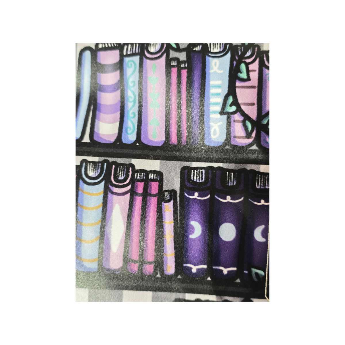 A close-up of a patterned surface featuring illustrated book spines arranged on shelves. The design uses black outlines with pastel and dark purple tones including pink, lavender, blue, and white accents.