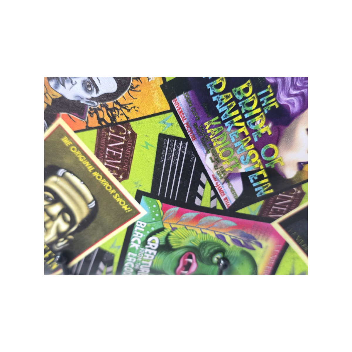 A square canvas print featuring a vibrant collage of vintage movie posters and clapperboards in bright, contrasting colors including green, yellow, purple, pink, and black.