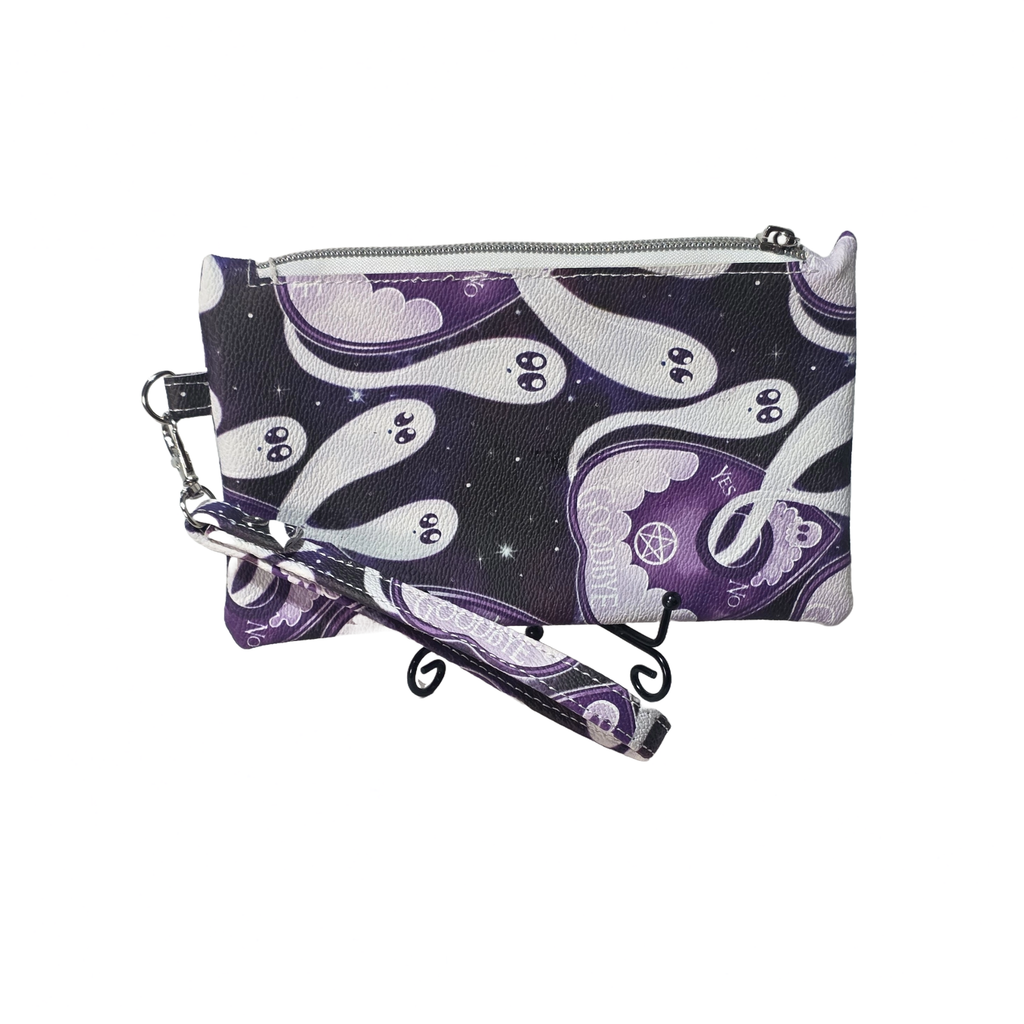 A small zippered pouch with a wrist strap, featuring a purple and white psychedelic ghost pattern on a dark background, shown on a plain white background.