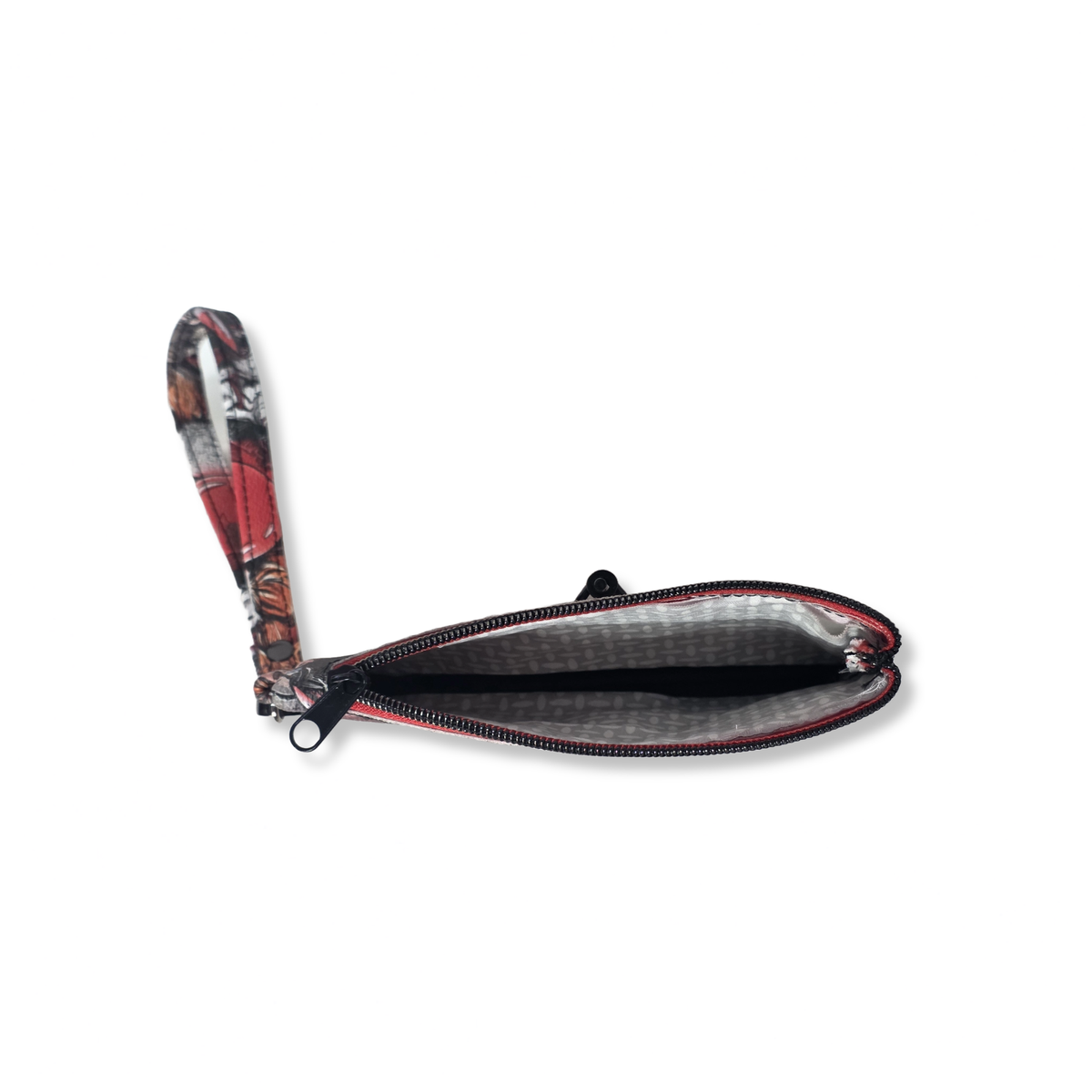 A small zippered pouch with a wrist strap, featuring a red, black, and white camouflage pattern on the exterior and a gray interior lining, shown open on a white background.