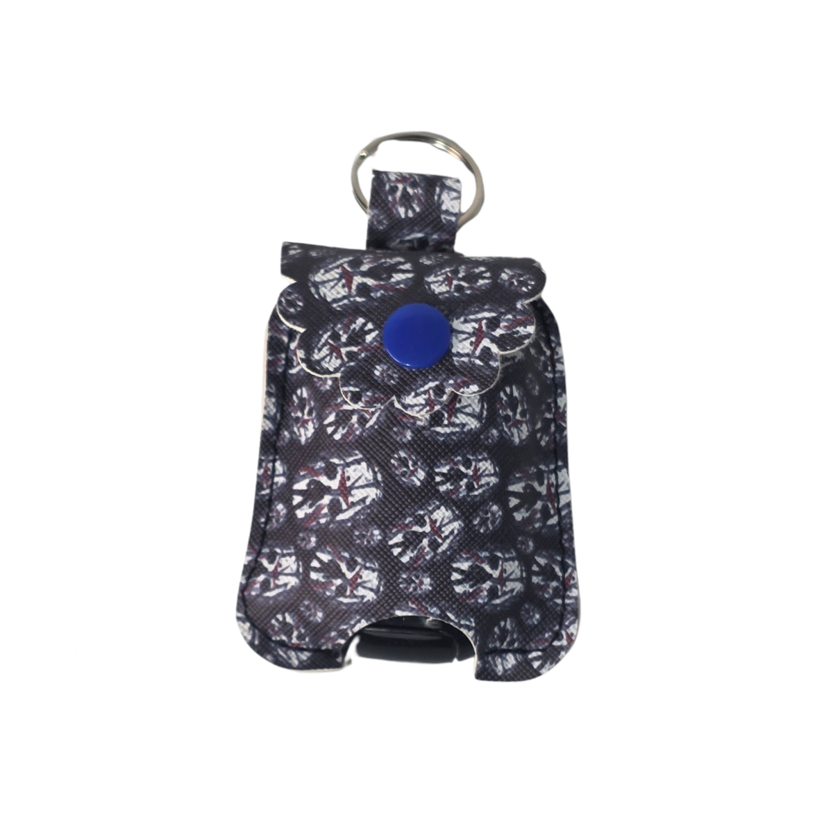 A small black and white camouflage-patterned pouch with a blue snap button and a silver metal key ring, shown on a plain white background.