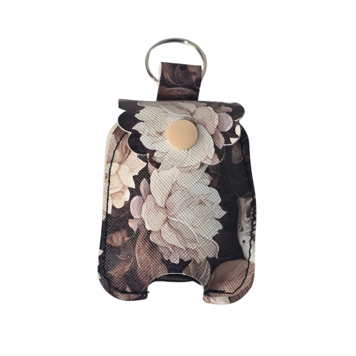 A small fabric pouch with a floral print in beige, brown, and black, featuring a scalloped edge, a snap button closure, and a metal key ring at the top, shown on a plain white background.