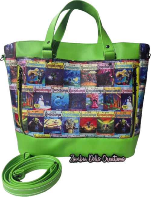 A bright lime green tote bag with a colorful collage print panel on the front featuring horror movie posters, shown with a matching green shoulder strap on a white background. A watermark for 'Zombie Dolls Creations' is visible at the bottom.