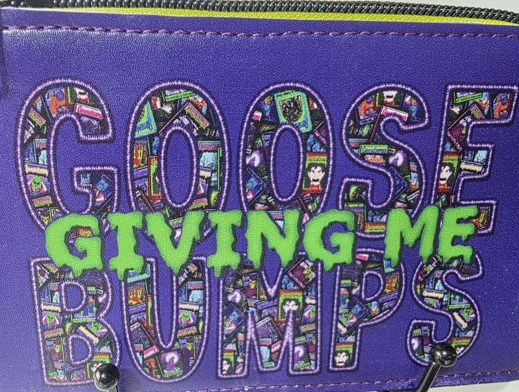 ZombieDolls Creations purple faux leather wallet with embroidered Giving Me Goose Bumps text and slime-green accents.