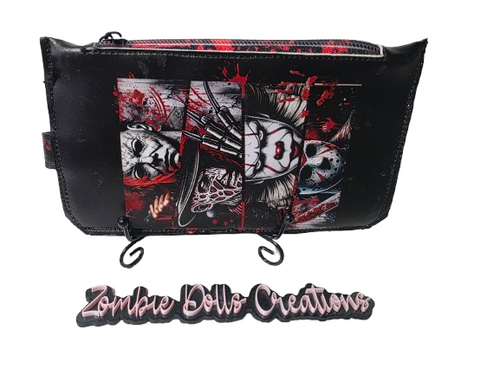 ZombieDolls Creations handmade horror wallet featuring a slasher movie collage with blood splatter and zip closure.